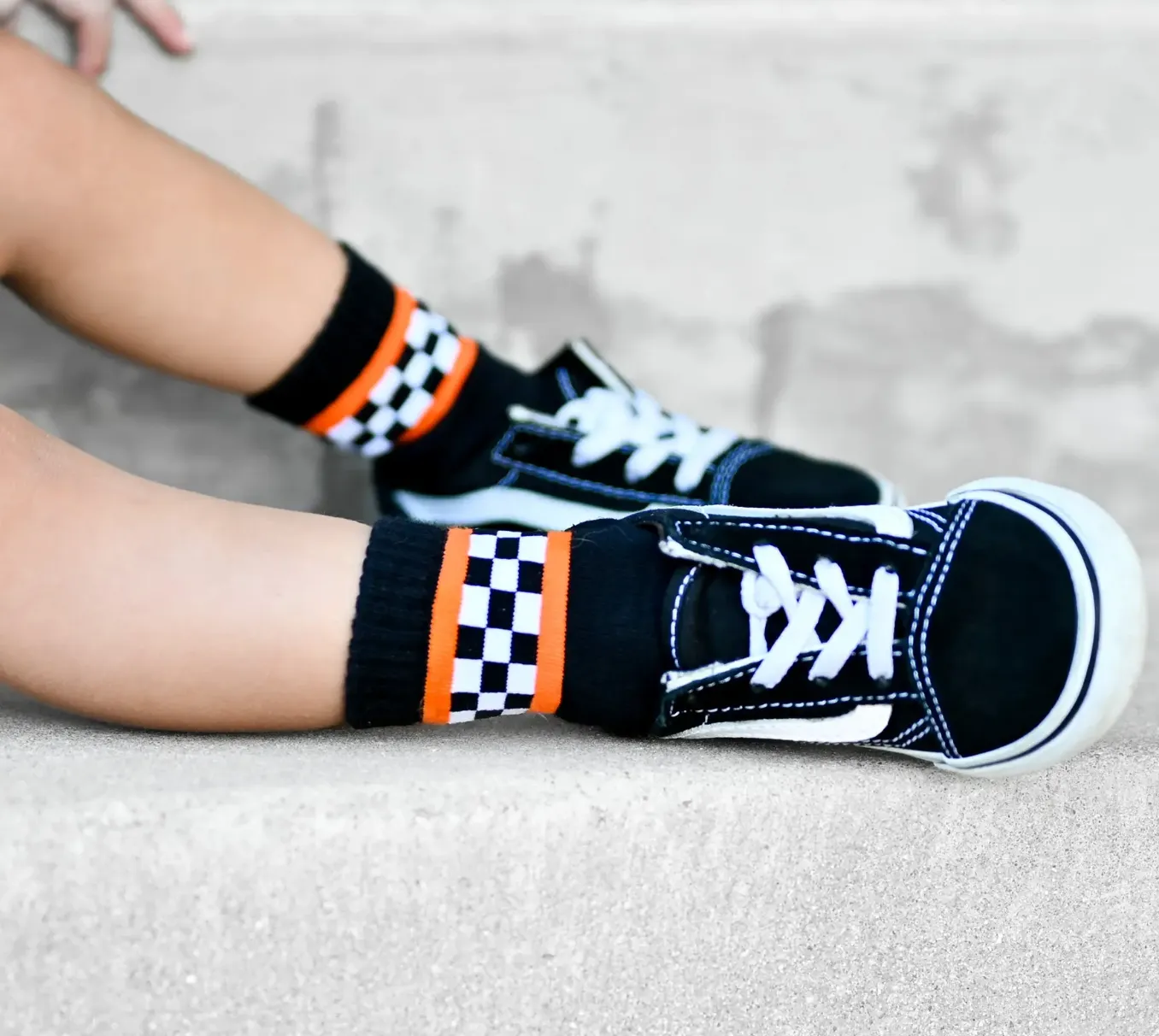 Kickin It Up Socks - Black/White Checkers and Orange Stripes